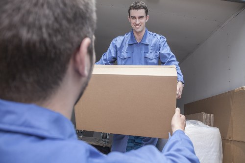 Removal truck and moving boxes in Brompton residential street