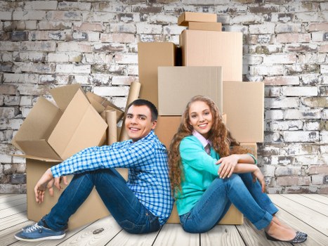 Trained movers using safe handling methods with protective equipment