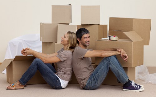 Furniture being moved through a Brompton flat with stairs