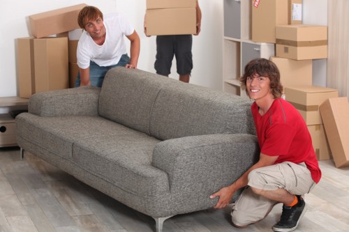 Professional movers handling boxes and furniture in Brompton
