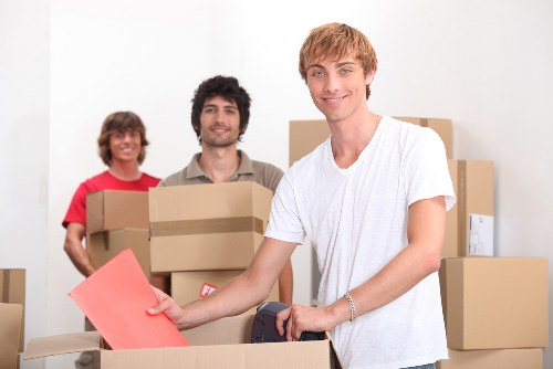Professional moving team organizing belongings for transport