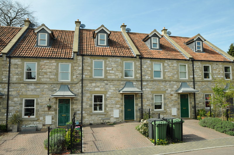 Local house movers handling furniture near a Brompton home